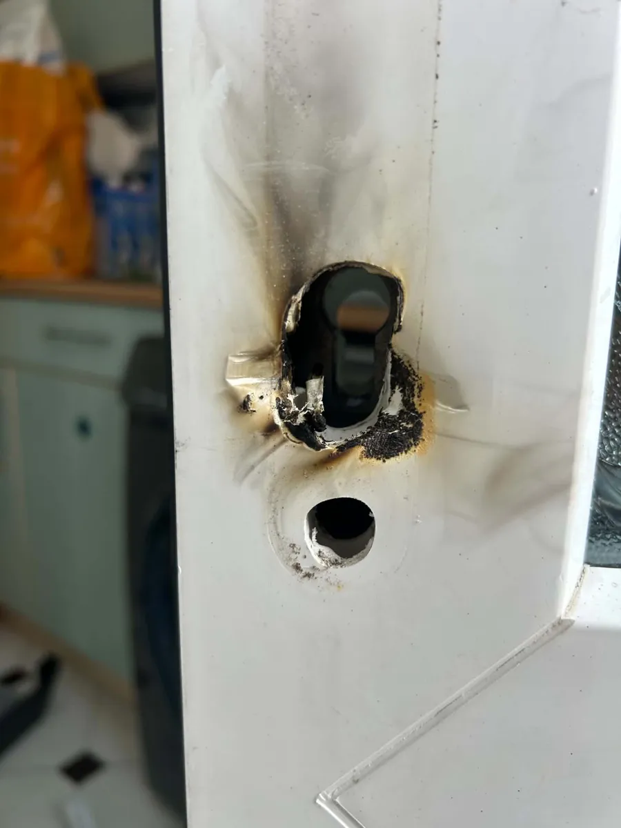 Burglary damage to a uPVC door lock before repair